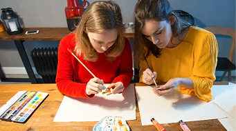 Two participants doing colouring by numbers activity together