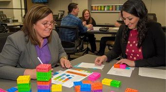 Participants building with lego blocks in a group workshop