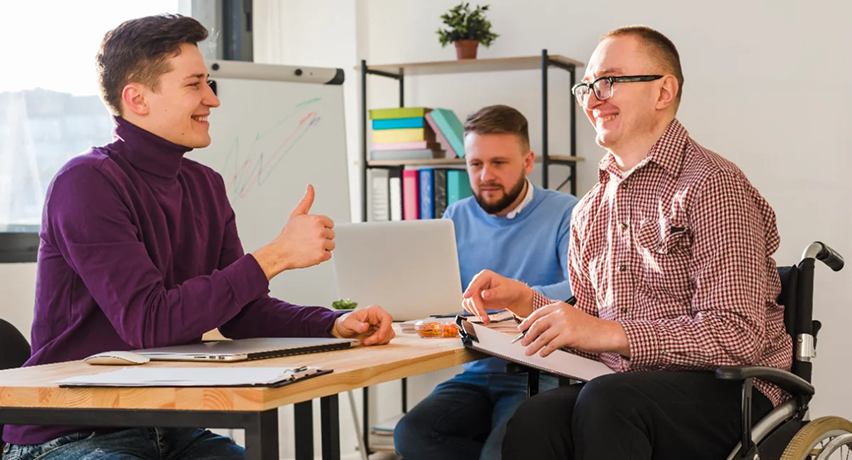Support coordinator team meeting with participants around a table