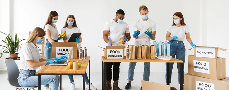 Volunteers packing food donation boxes for community support