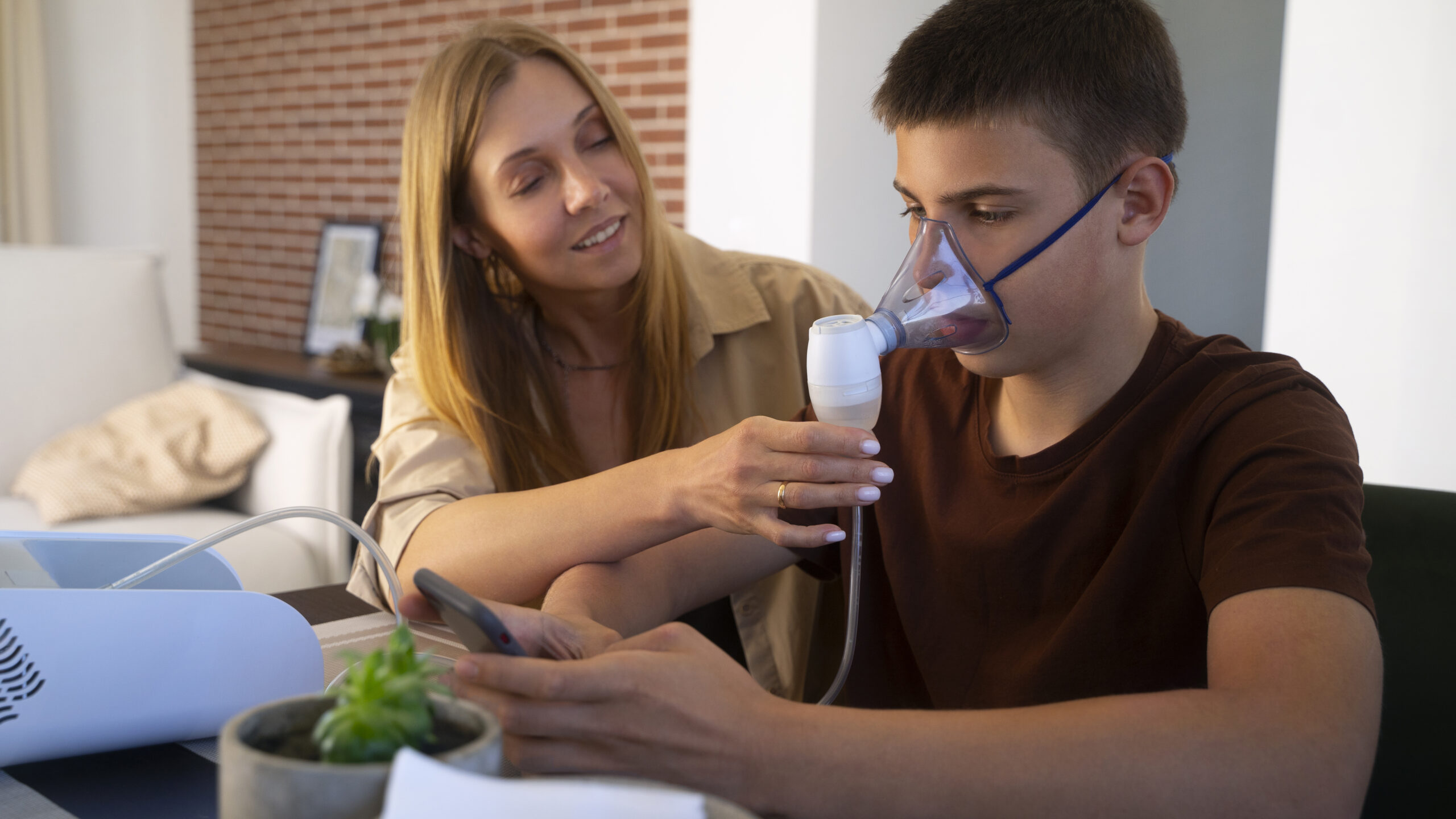 Support worker assisting a participant with respiratory equipment