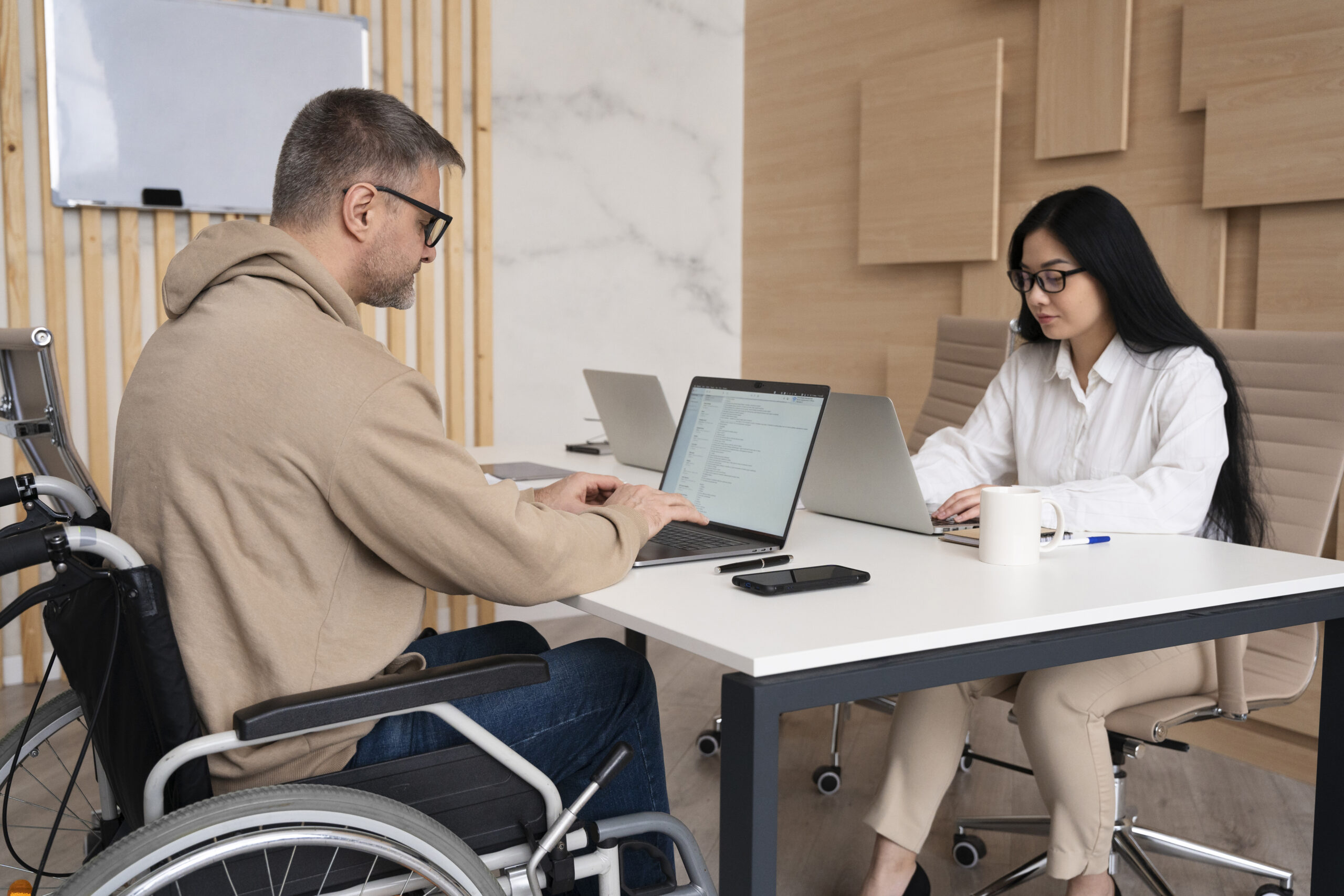 Support worker assisting a participant at a medical appointment
